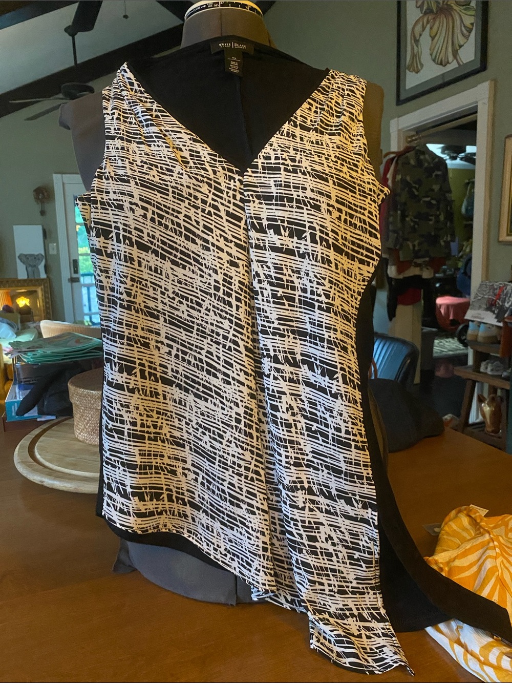White House Black Market sleeveless tunic geometric asymmetrical hem, v-neckline
